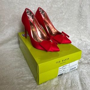 Red satin pumps